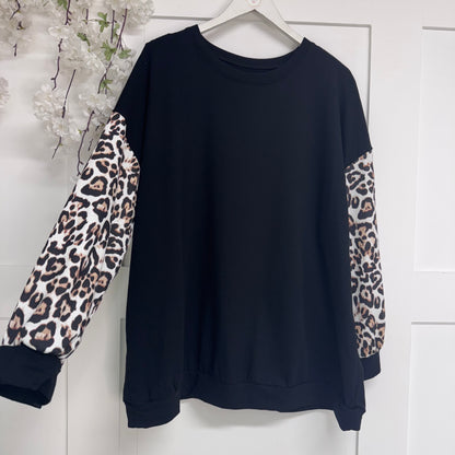 Marina: Lightweight top with leopard print sleeves. One size: 16-22