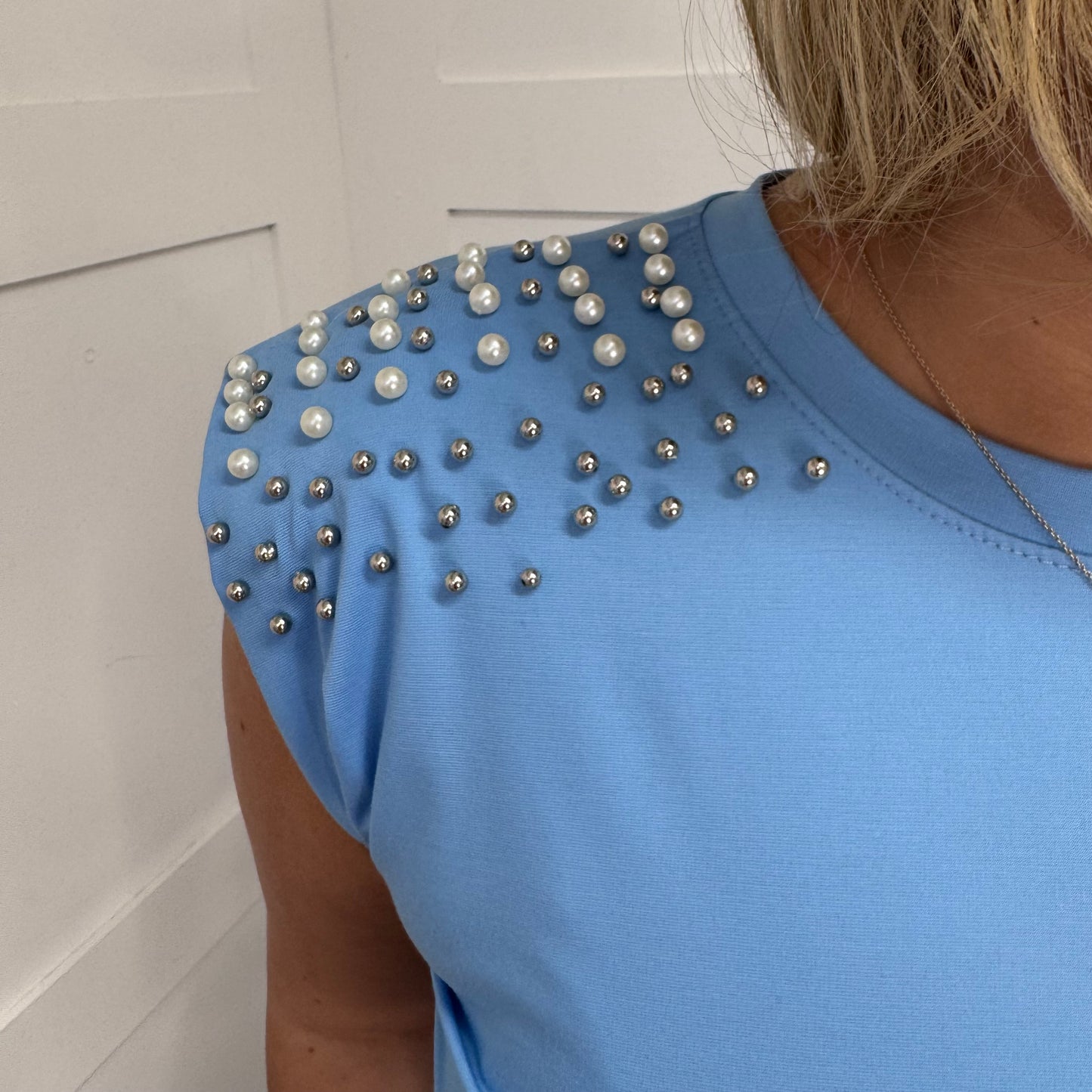 Kathy: Blue stud & pearl padded shoulder top. One size: 10-14