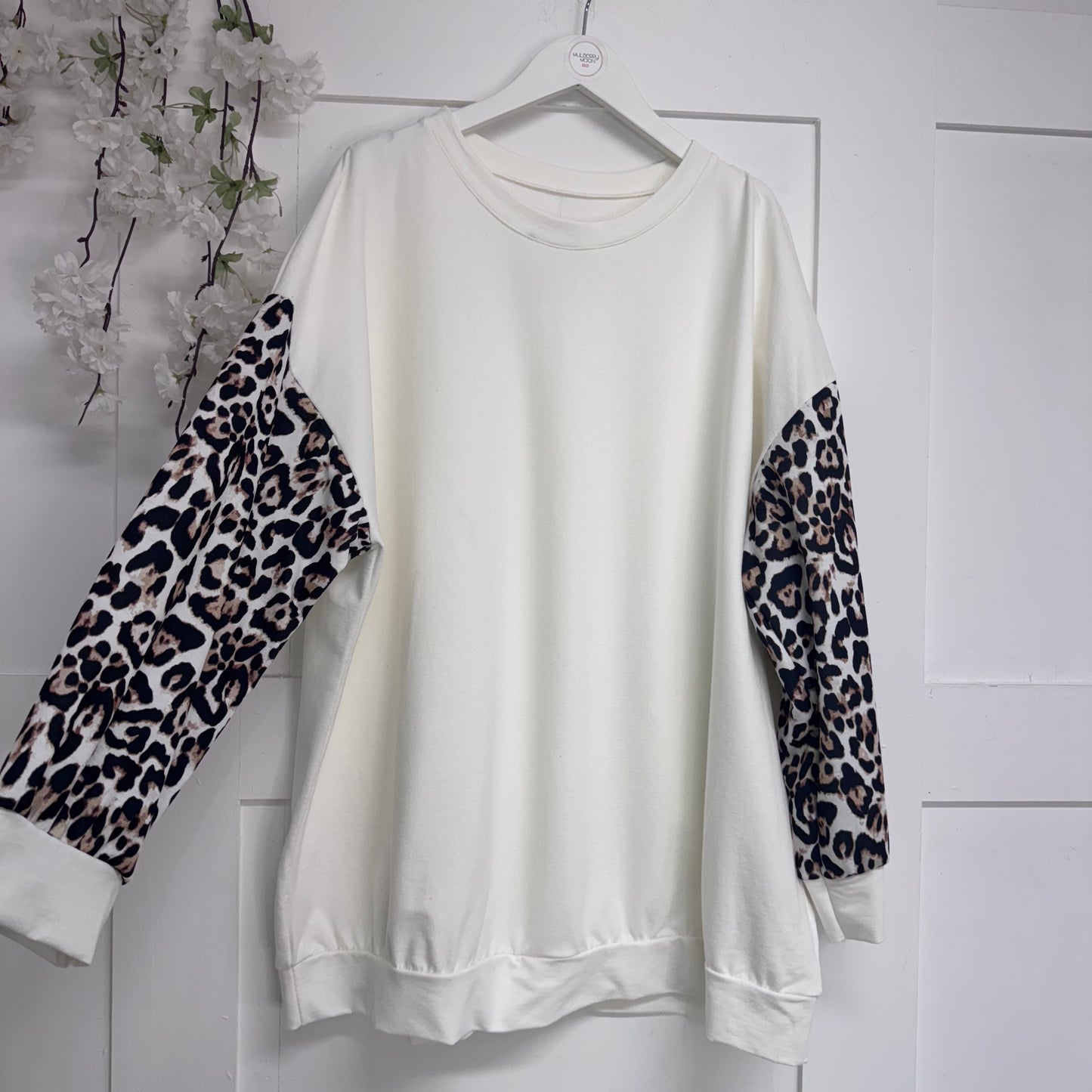 Marina: Lightweight top with leopard print sleeves. One size: 16-22