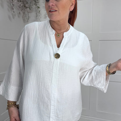 Vada: White cheesecloth cotton V neck button top. One Sz: 12-18