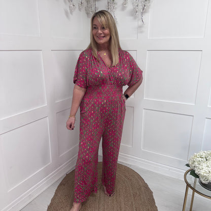 Maddie: Stretchy raspberry jumpsuit with pockets. One size: 12-20