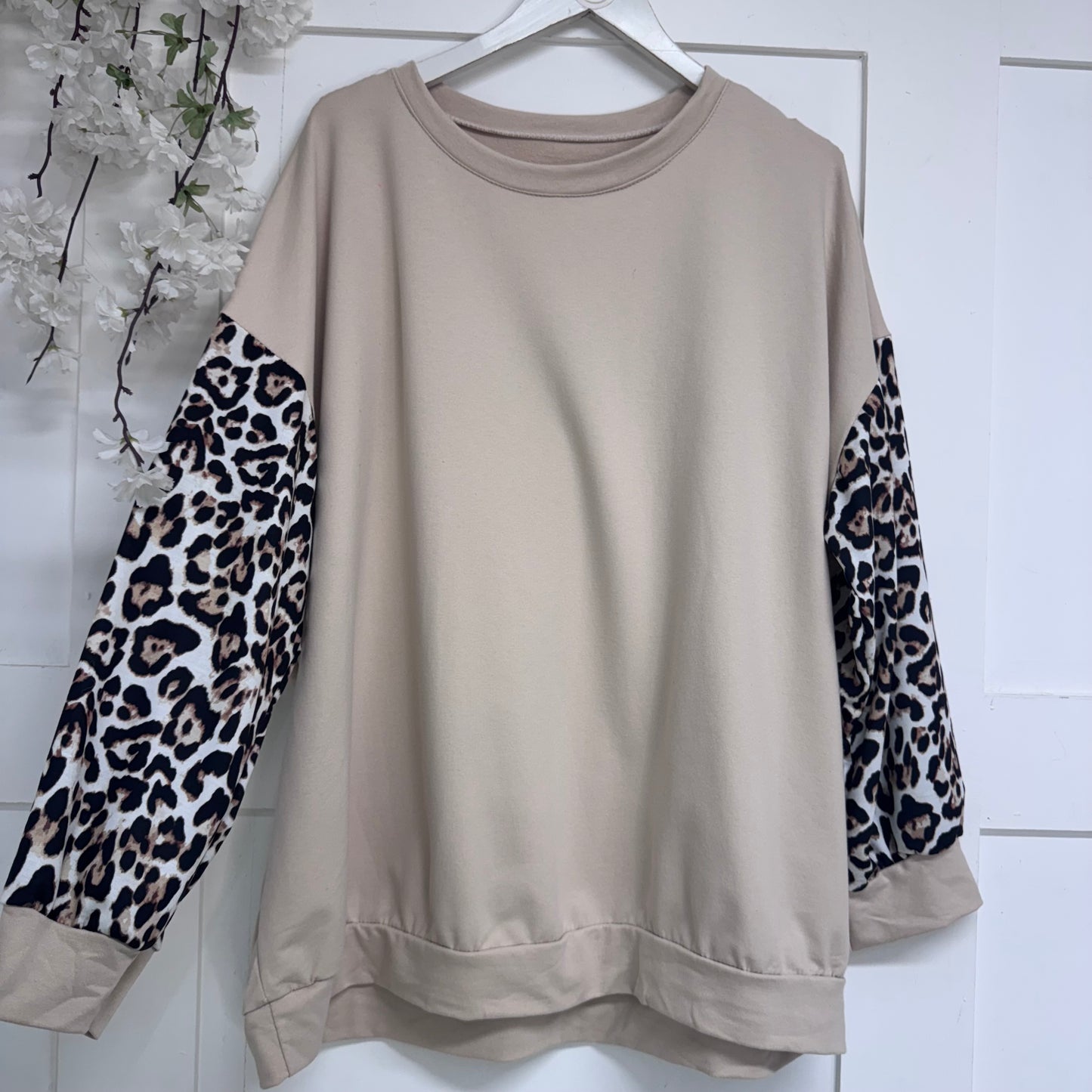 Marina: Lightweight top with leopard print sleeves. One size: 16-22