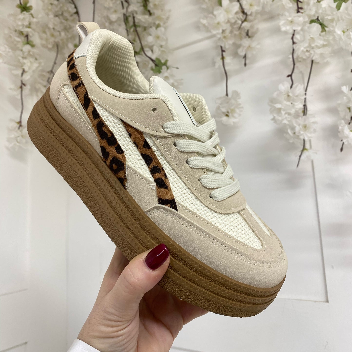 Bobbie: Cream trainers with leopard print stripe. Sizes: 3-8