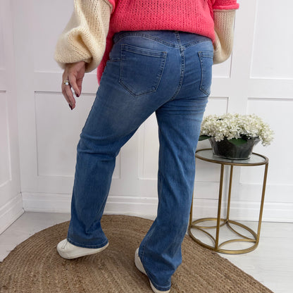 Lois: Mid wash wide leg jeans. Sizes: 10-20