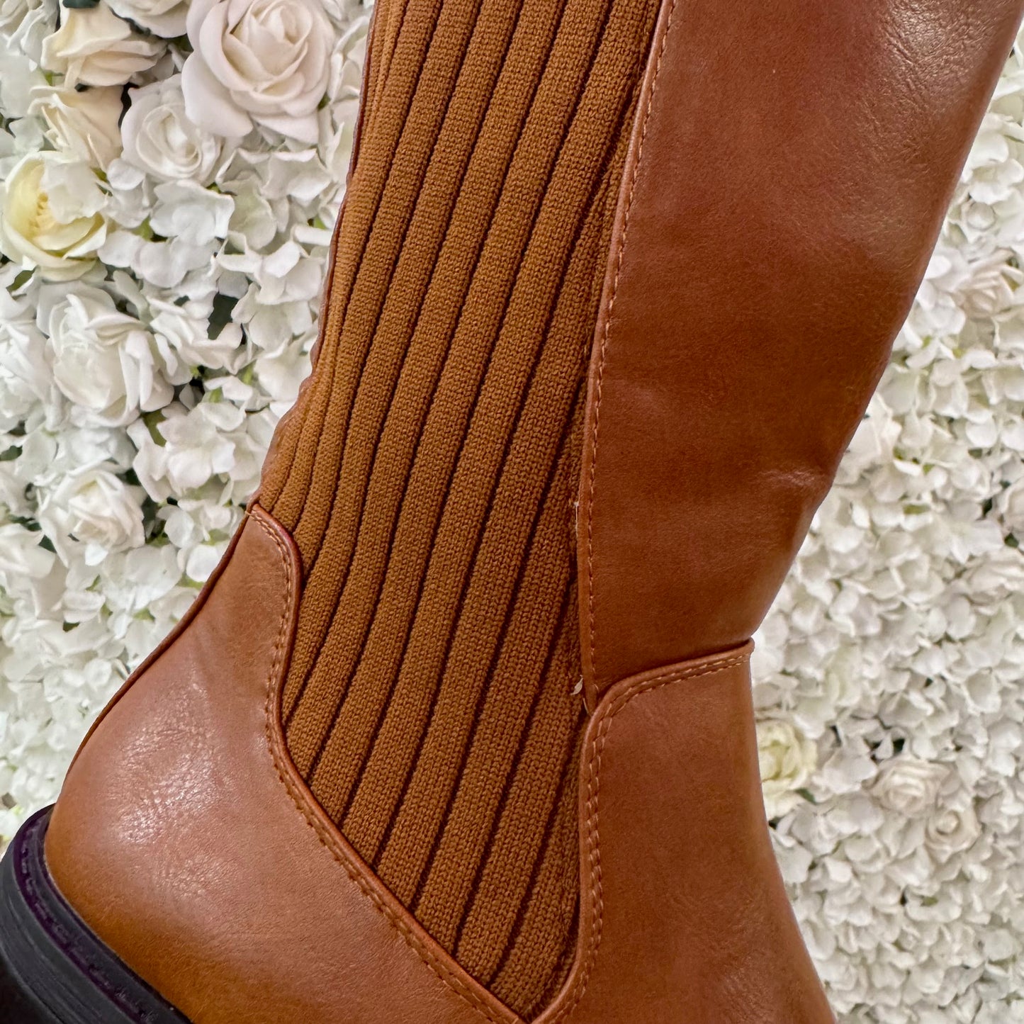 Trova Tan stretchy knee high boots. Sizes 3-8